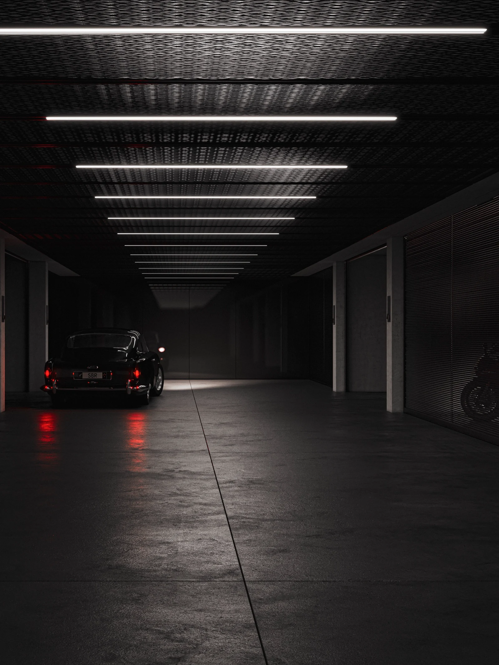 Private basement garage with a classic car under linear lighting